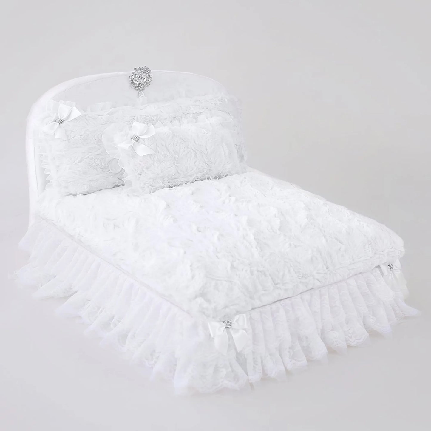 White feathered headpiece with decorative elements on a light gray background