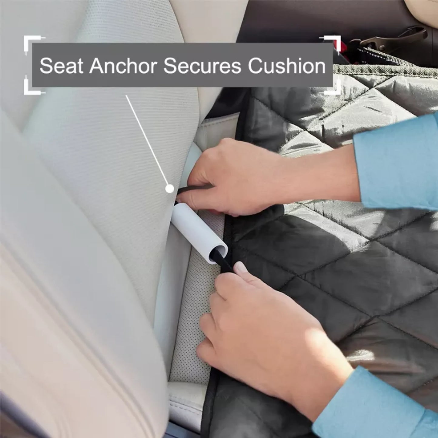 Person securing a car seat cushion with an anchor, showing the process of ensuring safety.