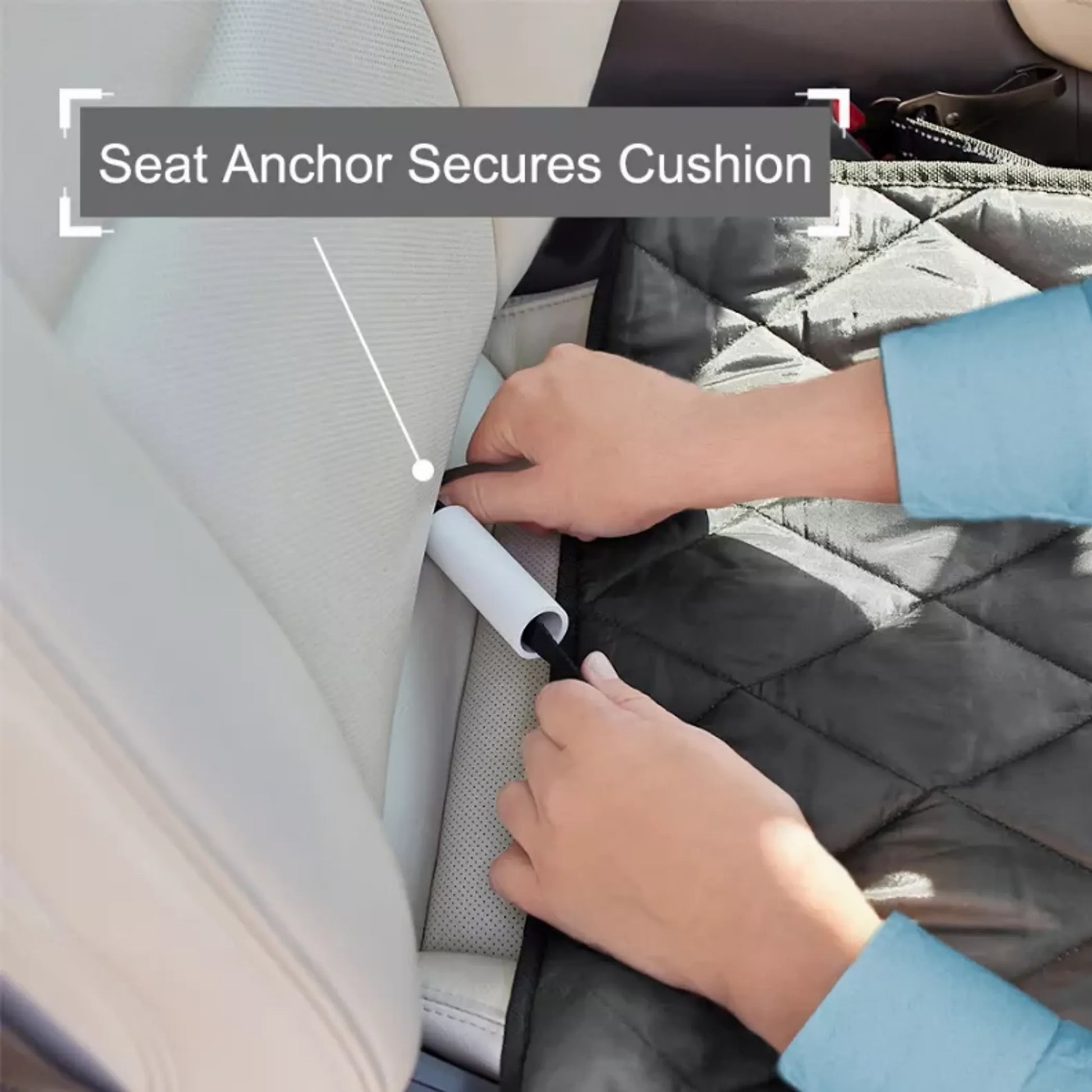 Person securing a car seat cushion with an anchor, showing the process of ensuring safety.
