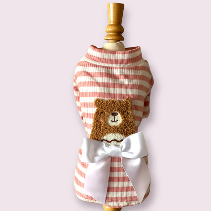 Dog outfit with pink  striped pattern and teddy bear design on a mannequin against a white background