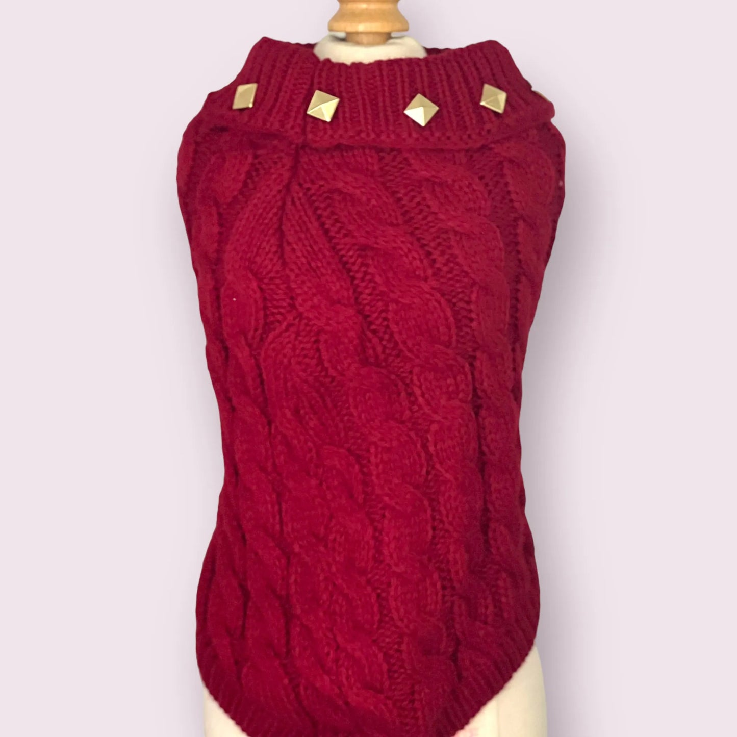 Red knitted dog sweater on a mannequin against a white background