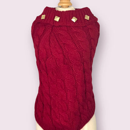 Red knitted dog sweater on a mannequin against a white background