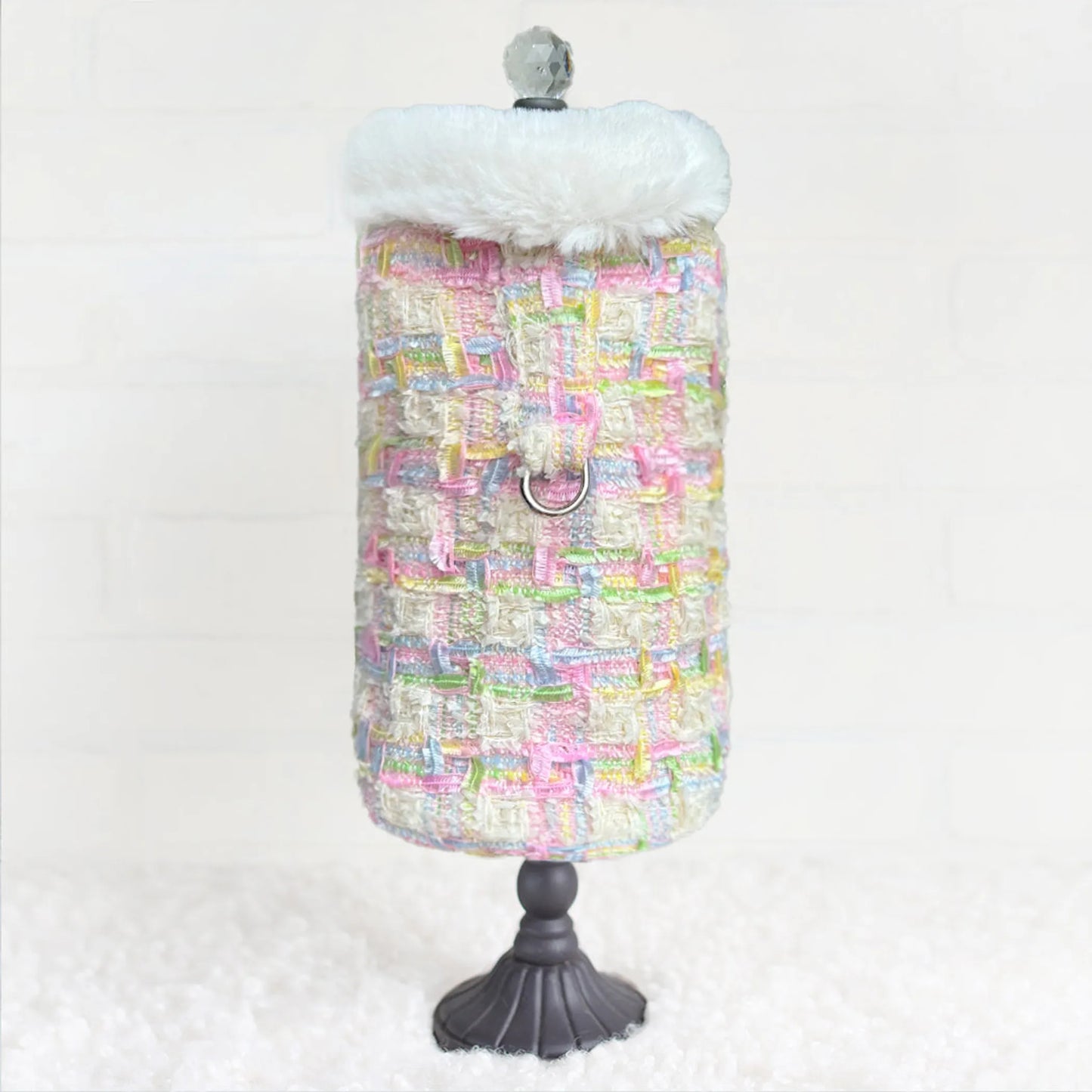 Colorful textured dress on a mannequin with a white background