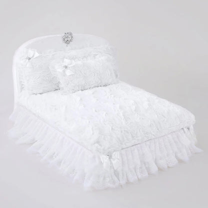White feathered headpiece with decorative elements on a light gray background